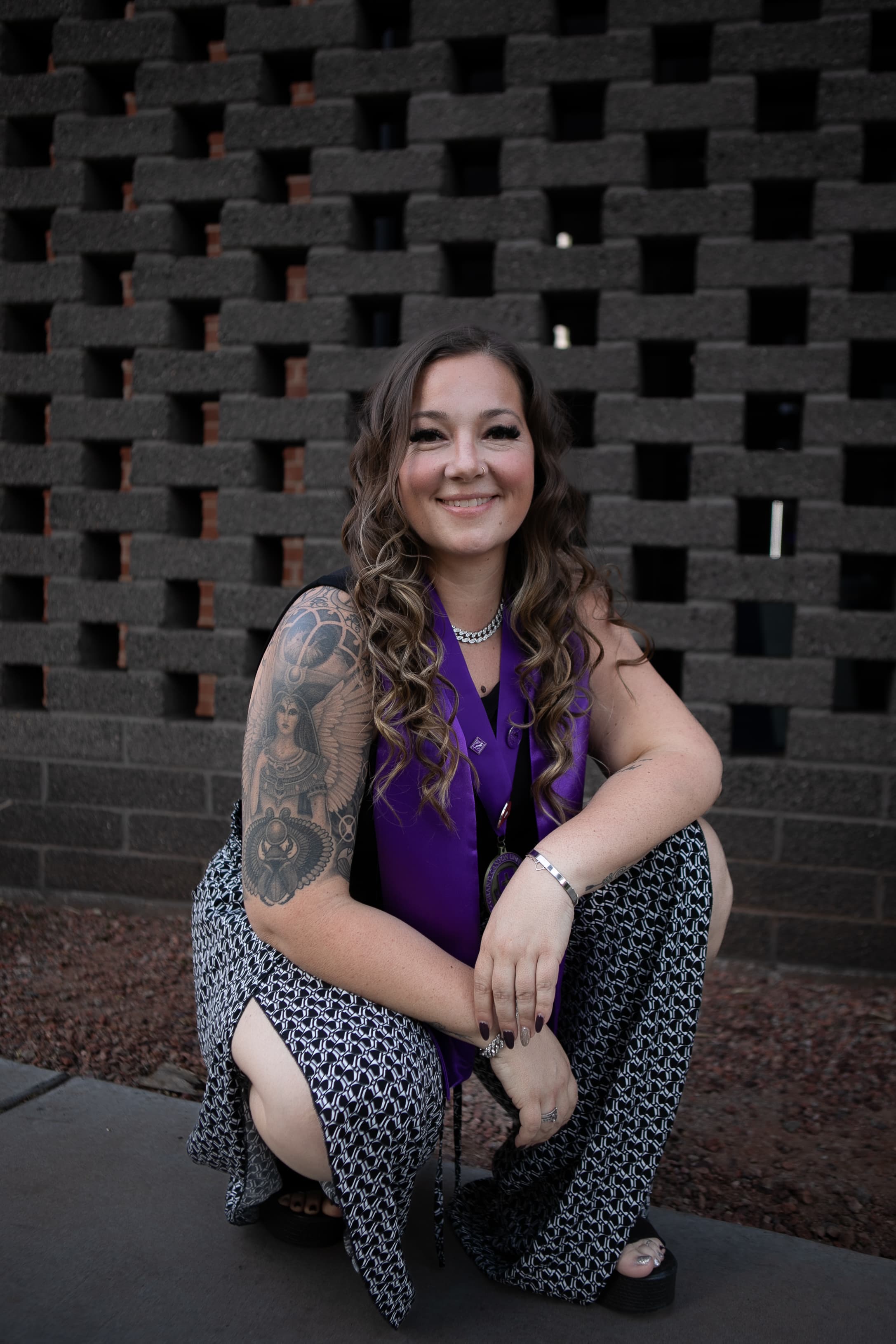 Kaleigh Williams, portrait wearing a purple honors stole, HiEnergy Consulting