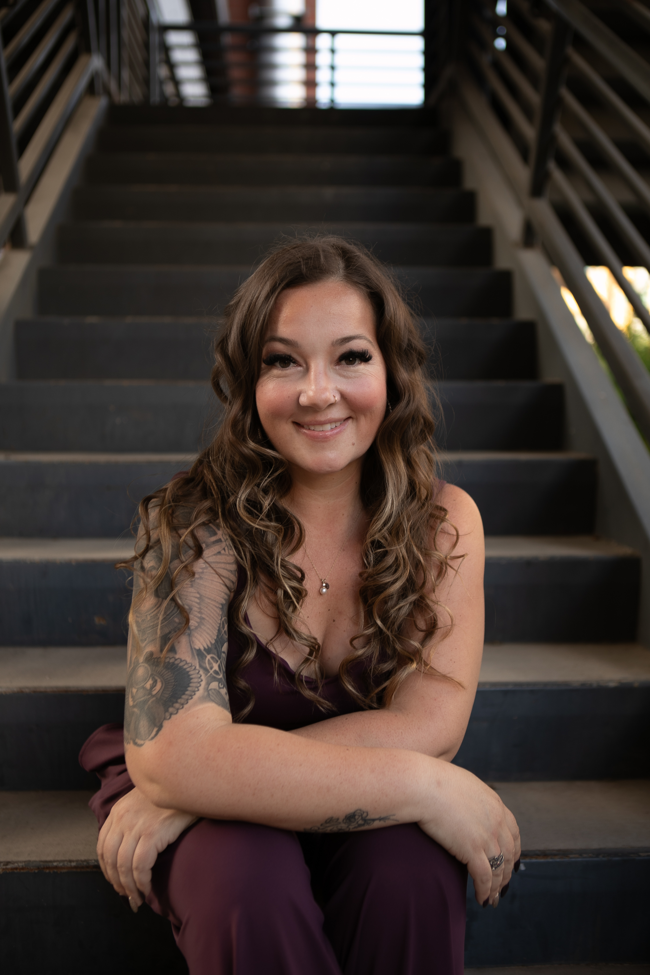 Kaleigh Williams, seated portrait with relaxed genuine smile, HiEnergy Consulting